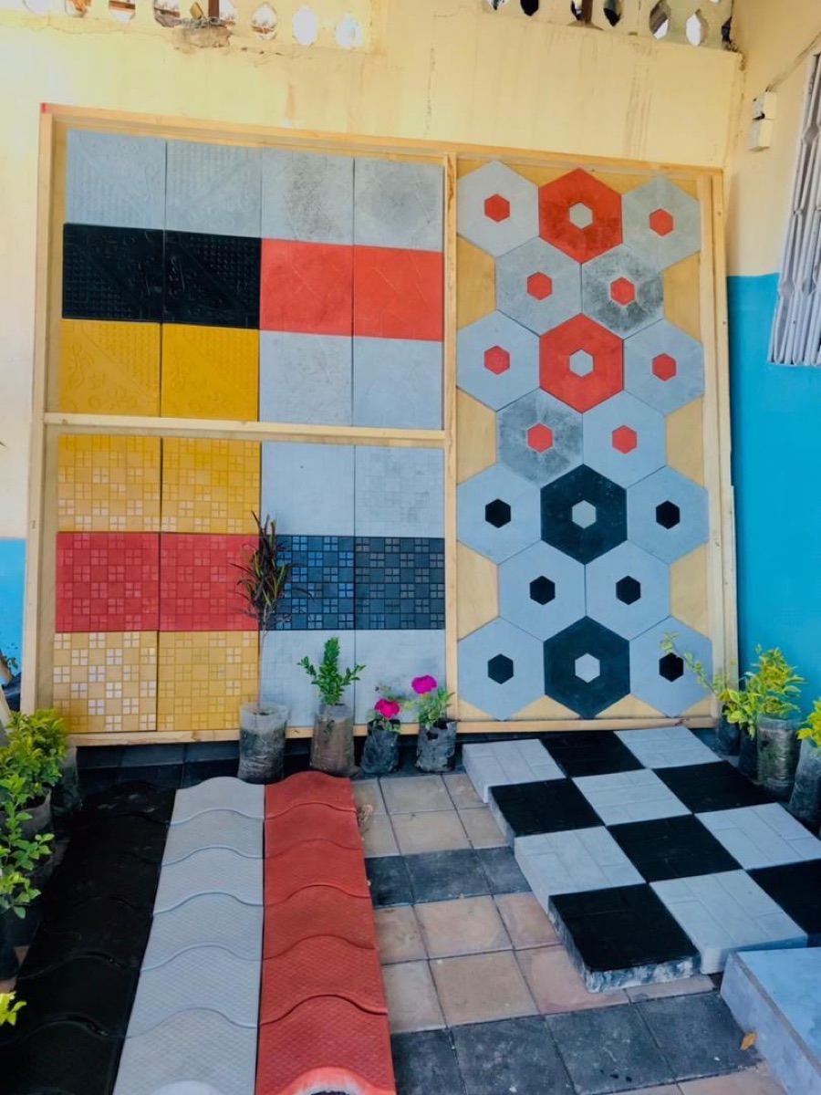 Colour sample wall above a checker floor
