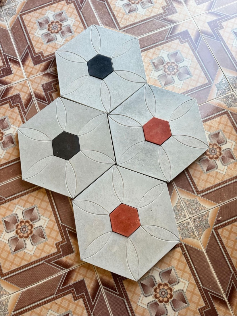 Hexagon tiles with red and black centres from the Iman Tiles factory